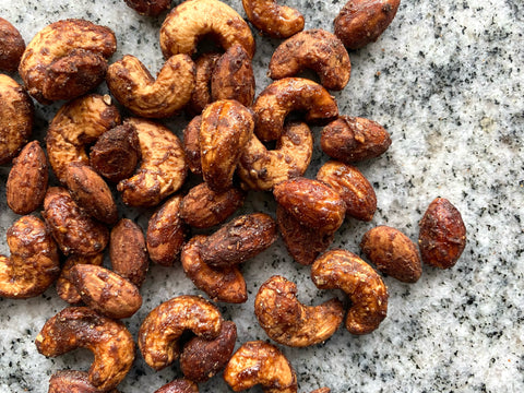 Sweet and spicy candied nuts on a granite countertop