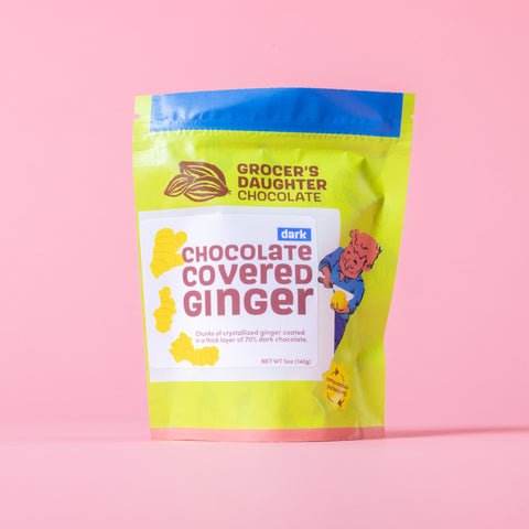 Grocer's Daughter Chocolate Covered Ginger package on a pink background