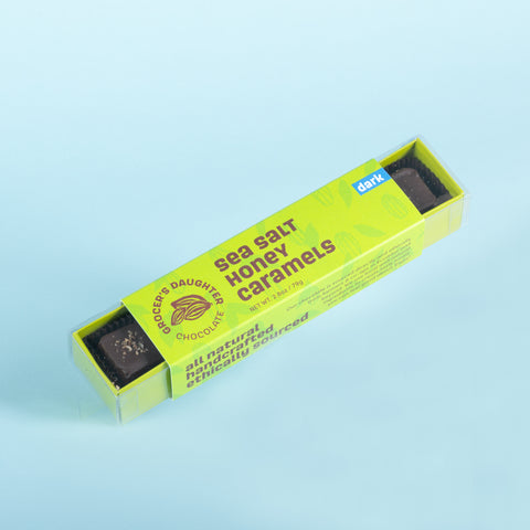 A box of smoked sea salt honey caramels, with dark chocolate option, packaged in a green box.