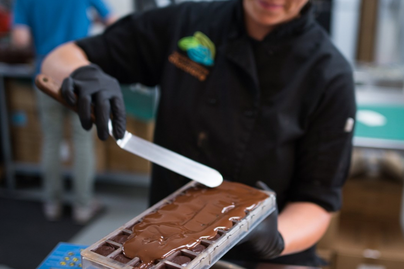 GDC chocolatier Sarah making truffles in our chocolate shop kitchen